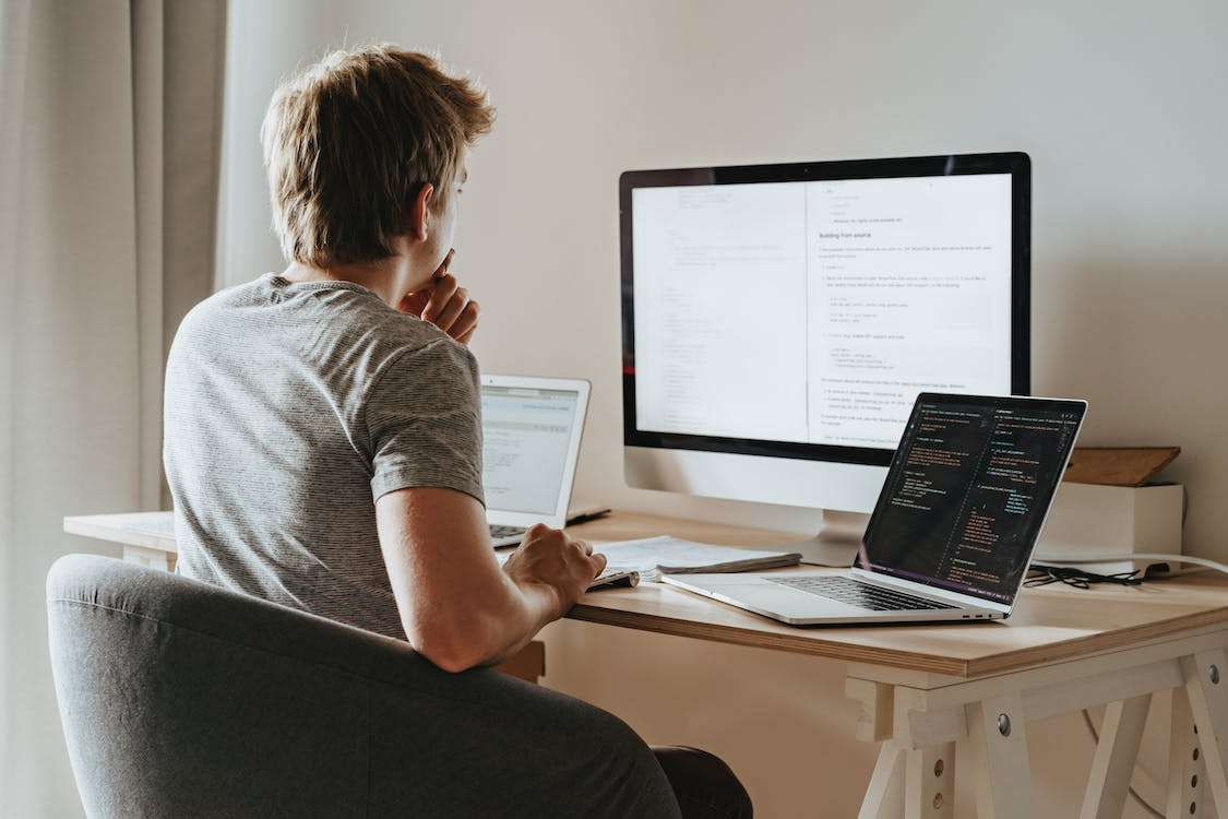 A man researching data on computers
